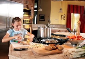 Child Cutting Vegetables
